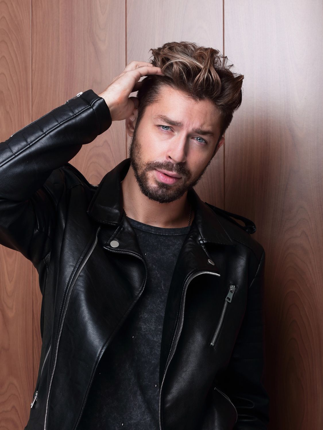 man touching his his hair