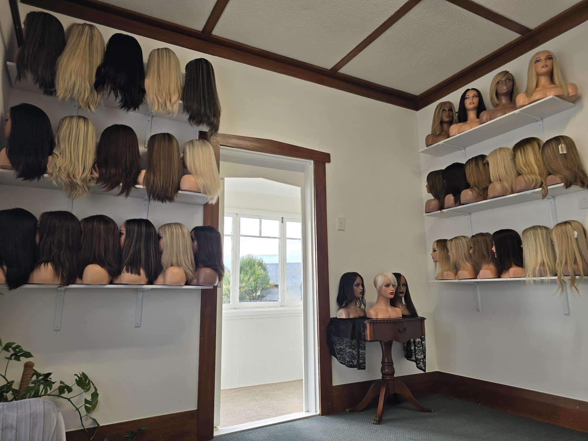 custom hair studio with selection of wigs